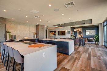Rooftop lounge with dining areas with ocean and city views